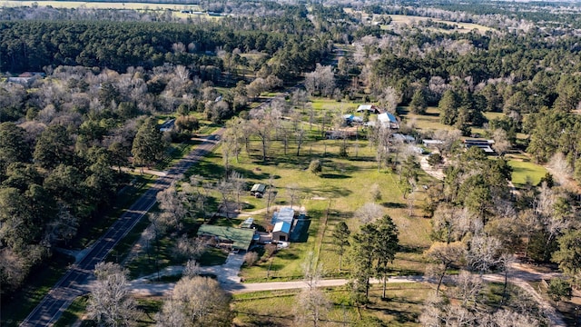 bird's eye view with a rural view and a wooded view