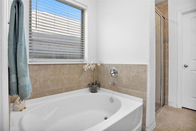 118 Emory Birch Dr, Montgomery, TX 77316 - full bathroom with a shower stall, a garden tub, and tile patterned flooring
