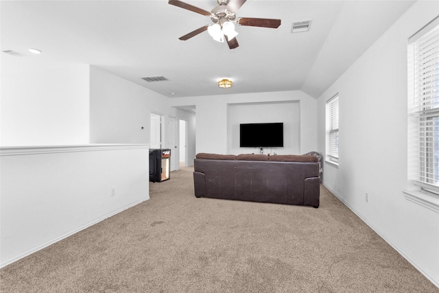 118 Emory Birch Dr, Montgomery, TX 77316 - carpeted living area with baseboards, vaulted ceiling, visible vents, and ceiling fan