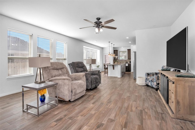 118 Emory Birch Dr, Montgomery, TX 77316 - living room featuring ceiling fan, recessed lighting, baseboards, and light wood-style flooring