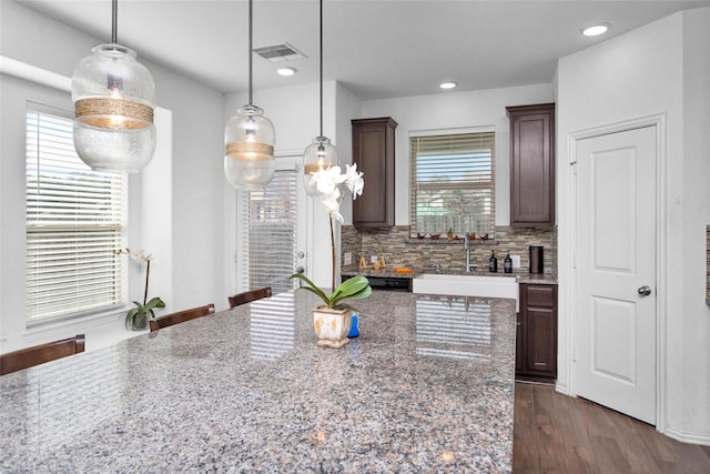 118 Emory Birch Dr, Montgomery, TX 77316 - kitchen featuring backsplash, a wealth of natural light, dark wood-style floors, and a sink