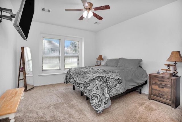 118 Emory Birch Dr, Montgomery, TX 77316 - carpeted bedroom with baseboards, visible vents, and ceiling fan