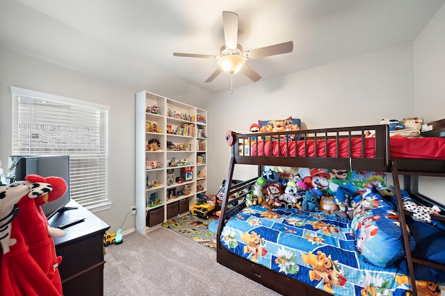 carpeted bedroom featuring baseboards and ceiling fan