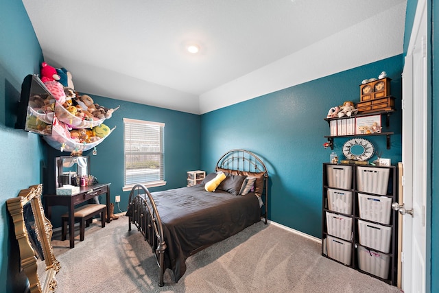 carpeted bedroom featuring baseboards