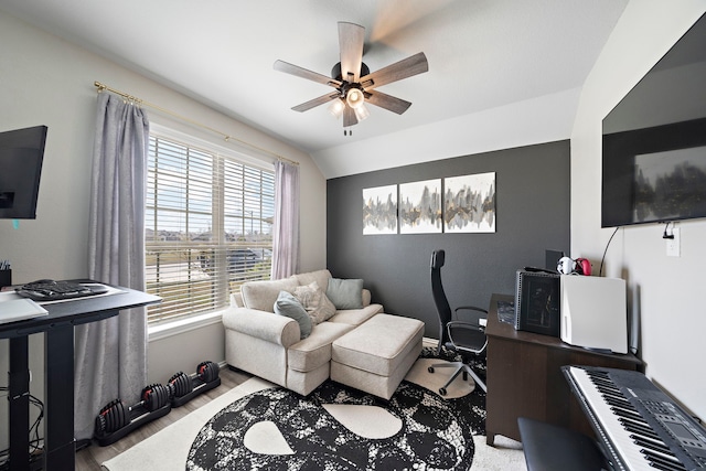 office featuring lofted ceiling, light wood-style floors, and ceiling fan