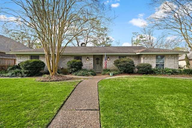 ranch-style house with brick siding and a front yard