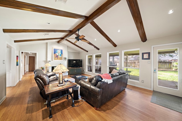 living area featuring a ceiling fan, baseboards, lofted ceiling with beams, recessed lighting, and light wood-style floors