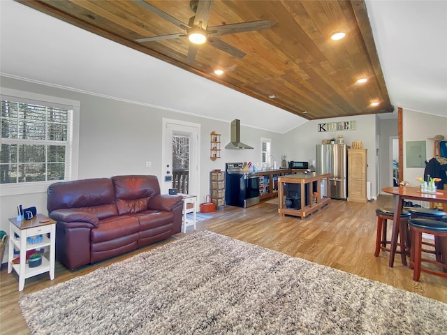 living room featuring light wood finished floors, lofted ceiling, ornamental molding, ceiling fan, and wood ceiling