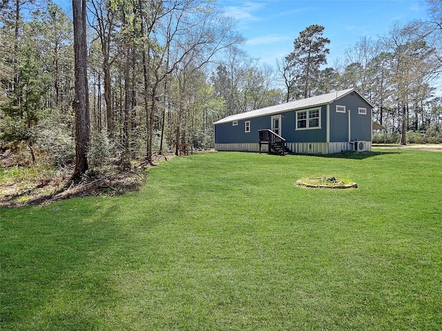 view of yard featuring entry steps