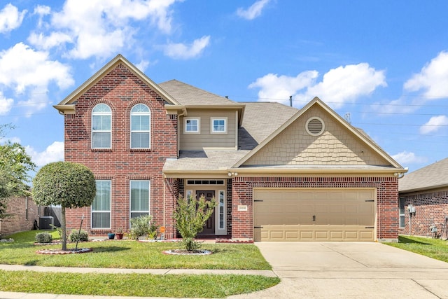 view of front of property with a garage, brick siding, concrete driveway, and a front lawn