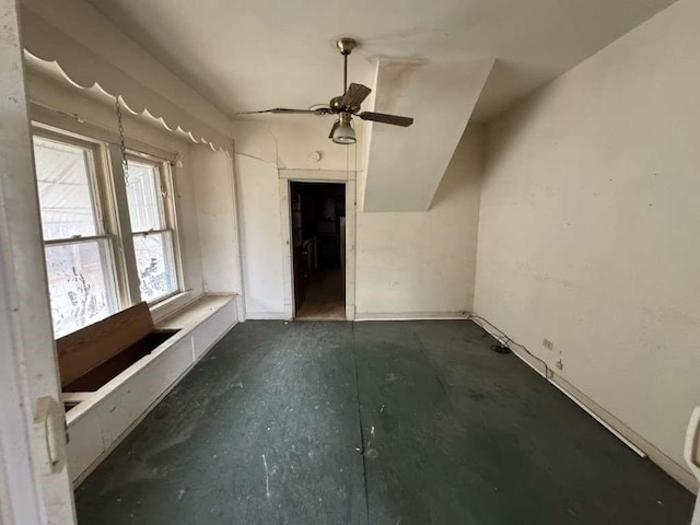 unfurnished living room featuring a ceiling fan