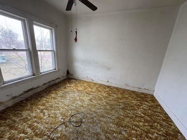 spare room featuring a ceiling fan