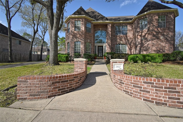 view of front of property featuring brick siding