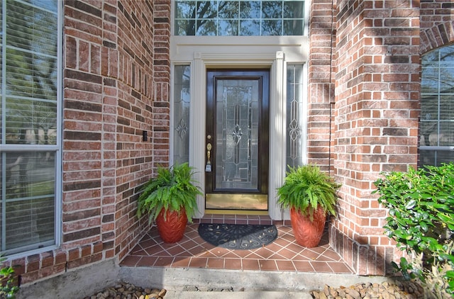 entrance to property with brick siding