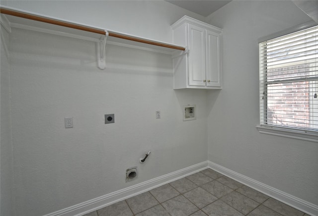 laundry room featuring washer hookup, hookup for a gas dryer, cabinet space, baseboards, and hookup for an electric dryer