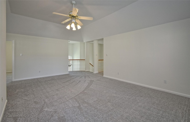 carpeted empty room with baseboards and ceiling fan