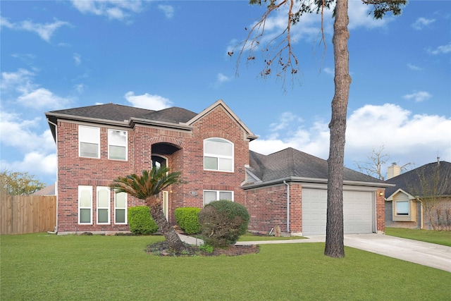 traditional-style house featuring brick siding, concrete driveway, and fence