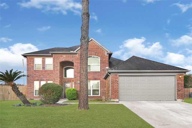 view of front of property featuring driveway, brick siding, a front yard, and fence