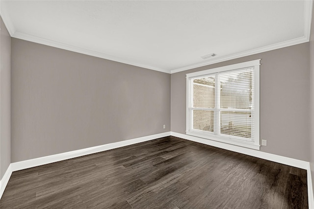 unfurnished room featuring dark wood-style floors, visible vents, and baseboards