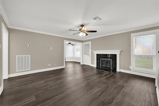 unfurnished living room featuring visible vents, dark wood-type flooring, ceiling fan, and a fireplace