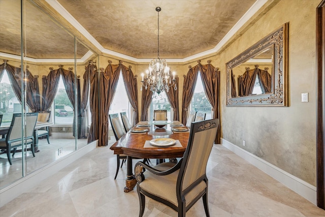 dining room with baseboards, a raised ceiling, an inviting chandelier, and ornamental molding