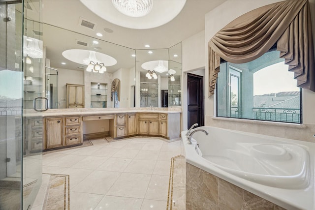 bathroom featuring vanity, a garden tub, visible vents, and a stall shower