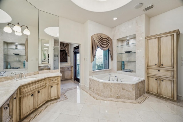 bathroom featuring visible vents, built in shelves, vanity, and a garden tub