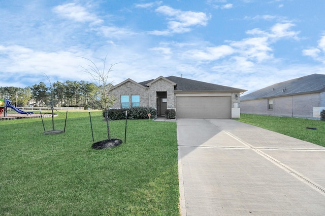 view of front of house featuring a front lawn, a playground, roof with shingles, concrete driveway, and a garage