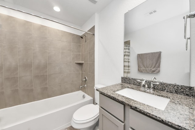 full bathroom featuring visible vents, toilet,  shower combination, and vanity