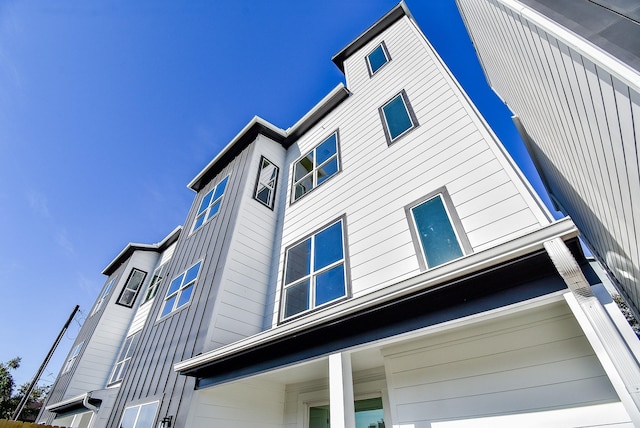 view of property exterior featuring an attached garage