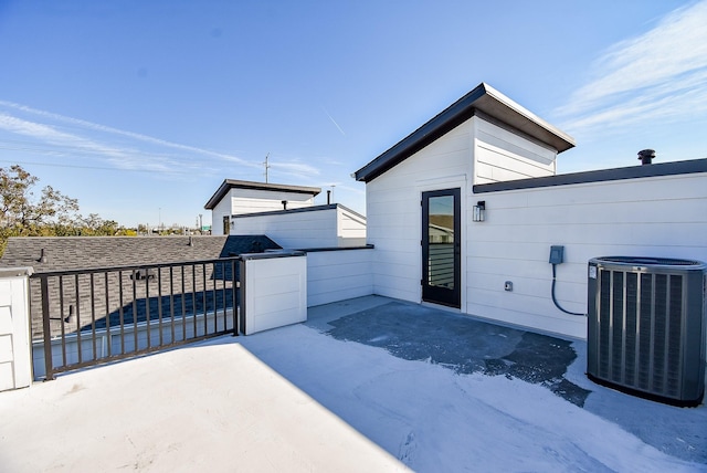 exterior space with central air condition unit and a patio area