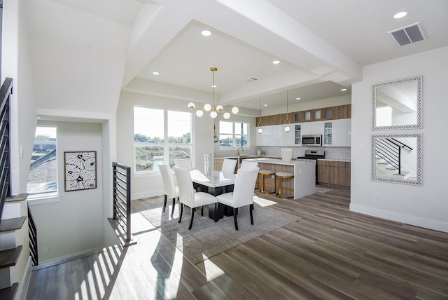 dining room featuring visible vents, recessed lighting, baseboards, and wood finished floors