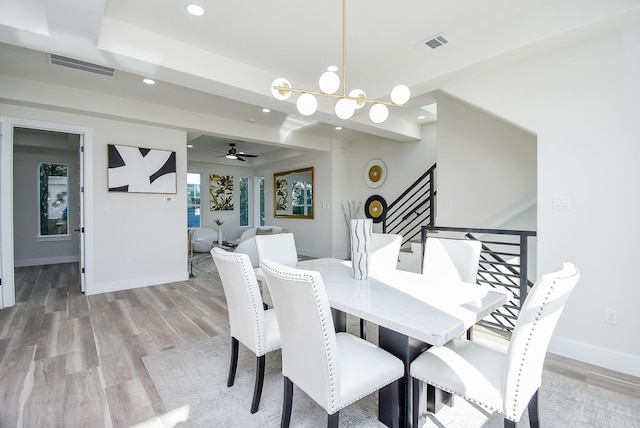 dining room with recessed lighting, light wood-style floors, visible vents, and baseboards