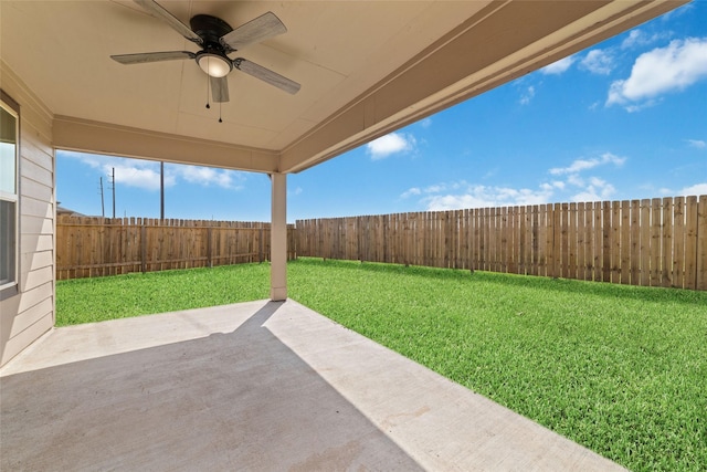 view of patio with a fenced backyard and a ceiling fan