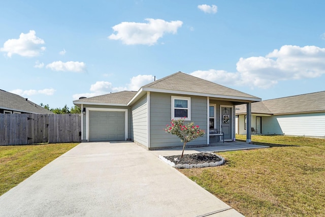 ranch-style home featuring a shingled roof, fence, a front yard, a garage, and driveway