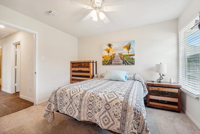 bedroom with baseboards, carpet, and ceiling fan