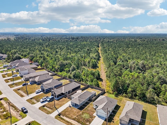 aerial view featuring a residential view and a view of trees