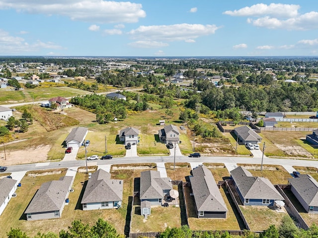 birds eye view of property with a residential view