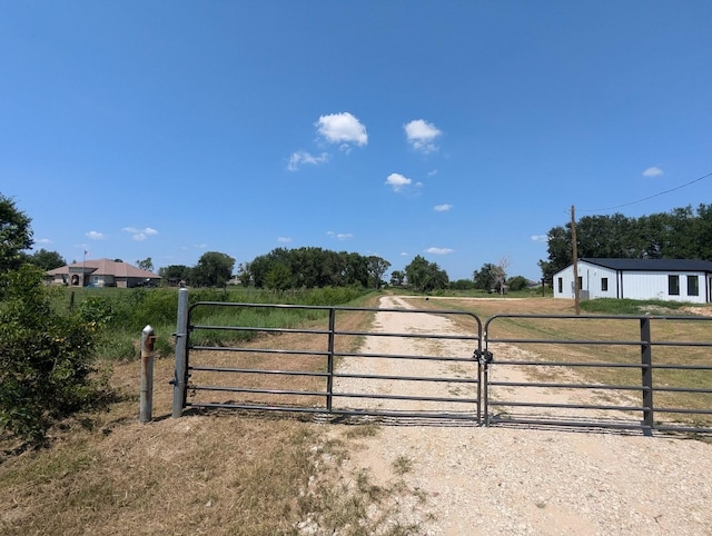 view of gate featuring a rural view