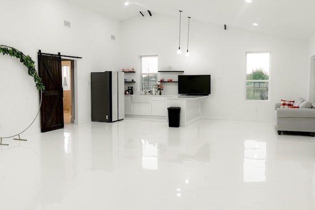 unfurnished living room featuring recessed lighting, a barn door, high vaulted ceiling, and visible vents