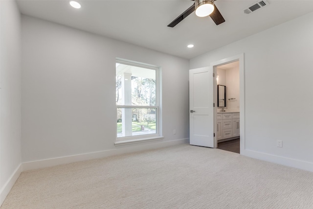 unfurnished bedroom with visible vents, ensuite bathroom, recessed lighting, carpet, and baseboards