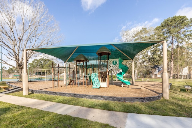 communal playground featuring fence