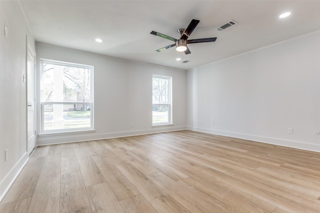 unfurnished room with recessed lighting, visible vents, light wood-style floors, and crown molding