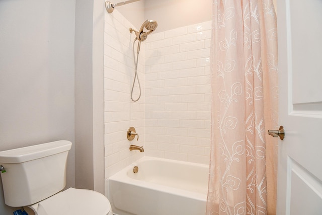 bathroom with shower / bath combo with shower curtain and toilet