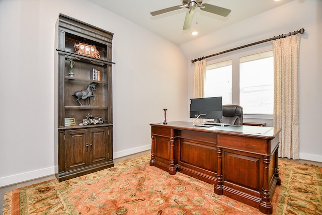 office with lofted ceiling, baseboards, and ceiling fan