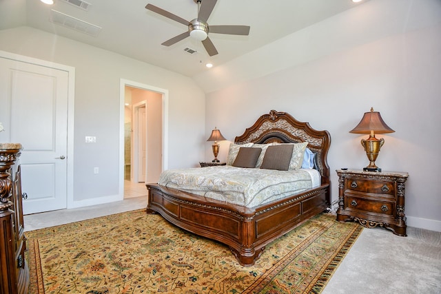 carpeted bedroom with lofted ceiling, baseboards, and visible vents