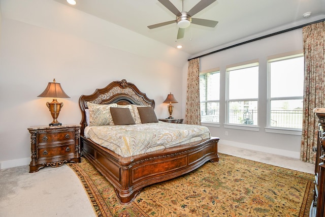 carpeted bedroom featuring lofted ceiling, recessed lighting, and baseboards