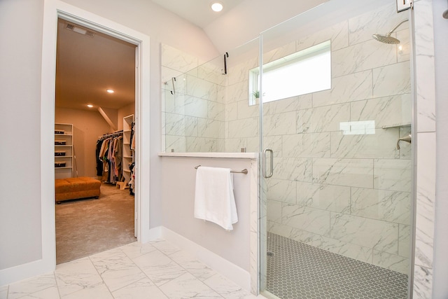 full bathroom featuring visible vents, a shower stall, a walk in closet, recessed lighting, and marble finish floor