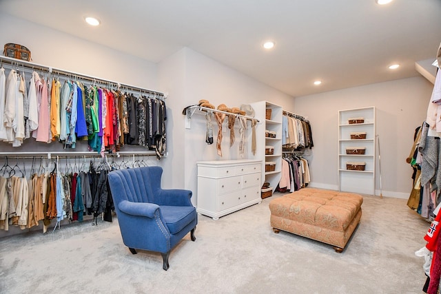 walk in closet with carpet