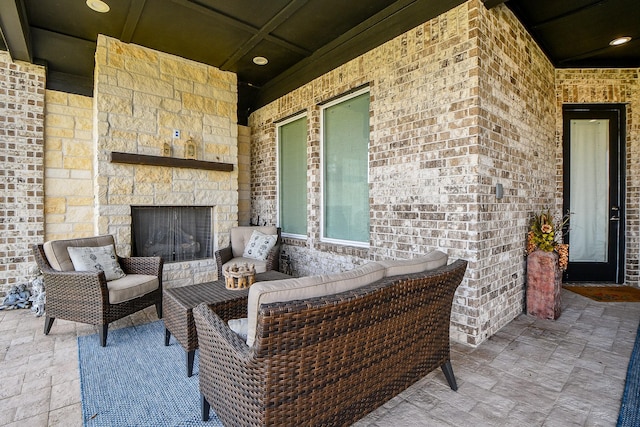 view of patio / terrace featuring an outdoor living space with a fireplace